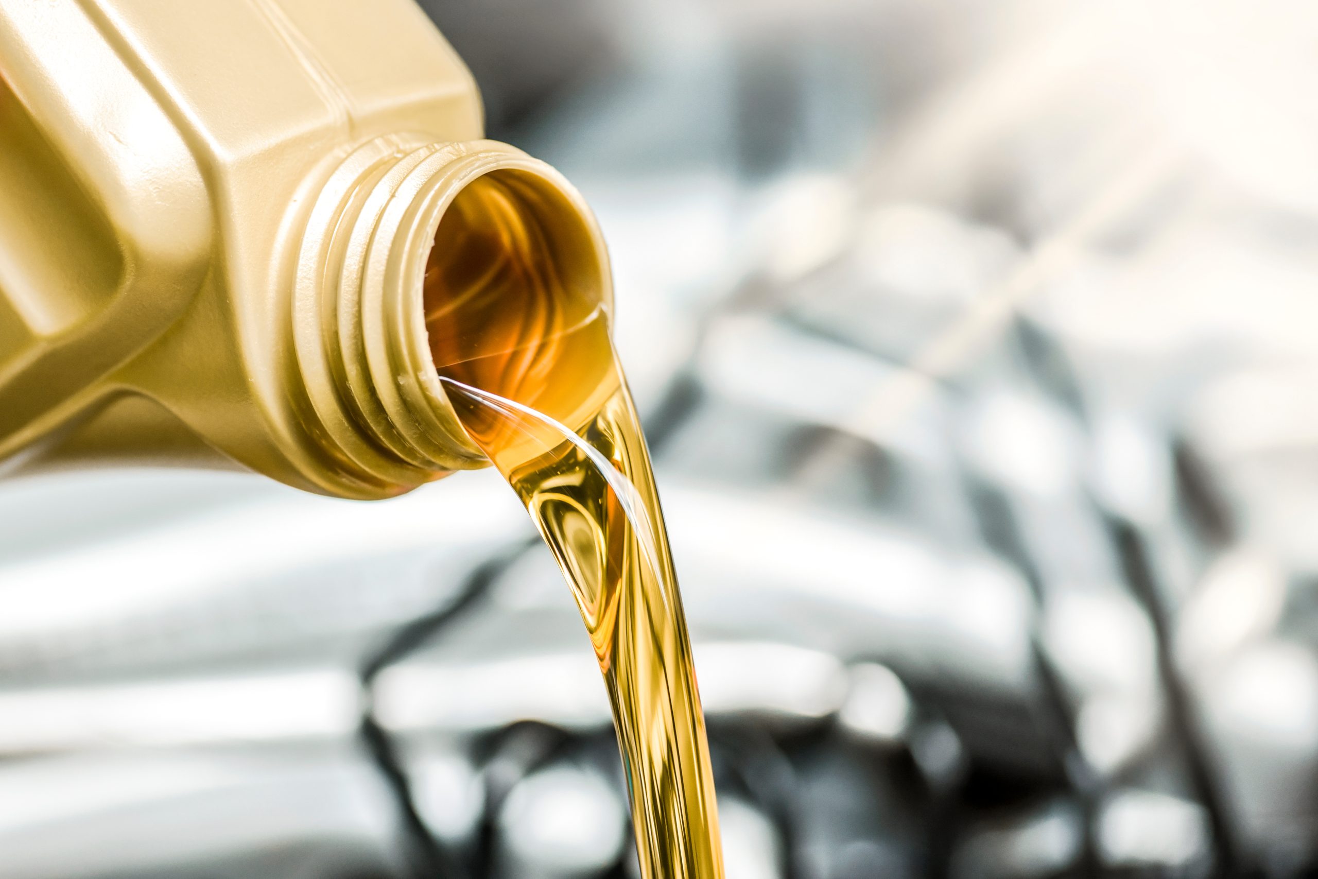 Image of fresh oil being poured during a winter oil change